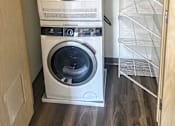 Thumbnail 15 of 26 - a washing machine and dryer in a laundry room