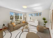 Thumbnail 10 of 52 - a living room with a couch and a glass coffee table