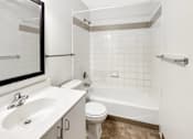 Thumbnail 13 of 40 - a bathroom with a sink toilet and a bath tub