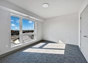 Thumbnail 7 of 22 - the living room of an apartment with a large window