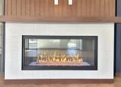 Thumbnail 30 of 36 - a fireplace is shown in a living room with a wood floor