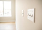Thumbnail 27 of 47 - Two white switches on a wall.