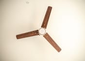 Thumbnail 25 of 47 - A ceiling fan with wooden blades and a white ceiling.