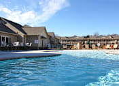 Thumbnail 1 of 37 - A swimming pool in front of a resort.