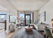 Thumbnail 1 of 35 - a living room with white walls and a large window with a view of a city
