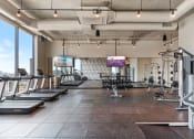 Thumbnail 16 of 35 - a large fitness room with treadmills and other exercise equipment