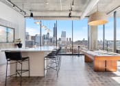 Thumbnail 13 of 35 - a game room with a pool table and a view of the chicago skyline