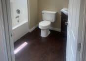 Thumbnail 7 of 8 - a small bathroom with a toilet and a shower