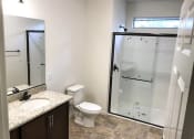 Thumbnail 17 of 29 - a bathroom with a toilet and a shower