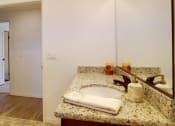 Thumbnail 21 of 29 - a bathroom with a sink and a white door
