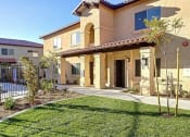 Thumbnail 3 of 29 - a house with a yard and a sidewalk in front of it