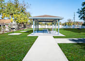 Thumbnail 30 of 61 - A pavilion with a white walkway in front of it. at Red Bay Apartment Complex, Jacksonville, FL, 32211