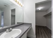 Thumbnail 53 of 61 - a bathroom with a sink and a mirror at Red Bay Apartment Complex, Jacksonville, Florida