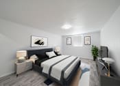 Thumbnail 7 of 61 - A bedroom with a large bed and a painting above it. at Red Bay Apartment Complex, Jacksonville, FL, 32211