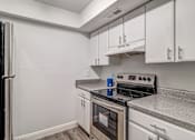 Thumbnail 51 of 61 - a kitchen with white cabinets and stainless steel appliances at Red Bay Apartment Complex, Florida, 32211