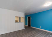 Thumbnail 55 of 61 - a bedroom with a blue wall and white walls at Red Bay Apartment Complex, Florida