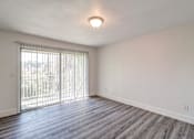 Thumbnail 39 of 61 - a bedroom with a large window and hardwood floors at Red Bay Apartment Complex, Jacksonville, FL