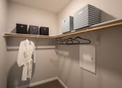 Thumbnail 21 of 28 - a walk in closet in a bedroom plus den unit.