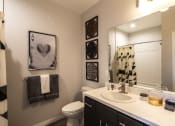 Thumbnail 22 of 28 - a bathroom with a toilet sink and mirror