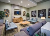 Thumbnail 19 of 22 - a living room with couches and a coffee table