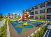 Thumbnail 13 of 22 - a playground at the flats at big tex apartments in san antonio, tx