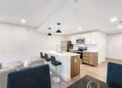 Thumbnail 11 of 53 - a living room and kitchen with a table and chairs at Current812, Indiana