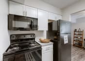 Thumbnail 18 of 30 - Kitchen with appliances at Halsey Flats, Louisville, KY, 40207
