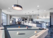 Thumbnail 31 of 53 - a clubhouse with a pool table and a kitchen with a bar at Current812, Clarksville Indiana