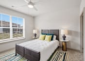 Thumbnail 5 of 29 - Bright bedroom with large window and ceiling fan at Viridian Apartments, Kentucky