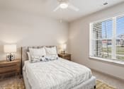 Thumbnail 4 of 29 - Bedroom with upholstered bed and ceiling fan at Viridian Apartments, Kentucky, 42104