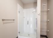 Thumbnail 7 of 24 - a bathroom with a shower and a closet