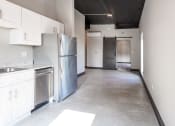Thumbnail 10 of 24 - a kitchen with white cabinets and stainless steel appliances