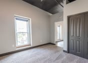 Thumbnail 11 of 24 - an empty room with a window and a door