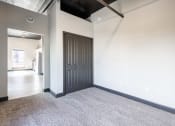 Thumbnail 12 of 24 - an empty room with white walls and a black ceiling