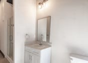 Thumbnail 13 of 24 - a bathroom with a sink and a mirror