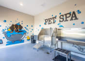 Thumbnail 25 of 27 - a pet spa with a dog in a tub and a wall mural of a dog at Arlington Farms, Greenwood