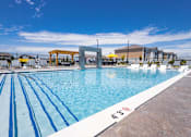Thumbnail 18 of 48 - Resort style pool with water feature and lounge chairs at Allure Apartments, Whiteland, Indiana