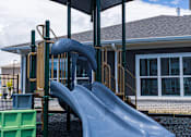 Thumbnail 47 of 48 - Playground with slides and shade canopy at Allure Apartments, Whiteland