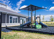 Thumbnail 39 of 48 - Playground with slides and shade cover at Allure Apartments, Indiana