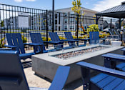 Thumbnail 48 of 48 - Outdoor fire pit with blue adirondack chairs at Allure Apartments, Indiana, 46184
