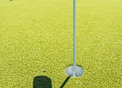 Thumbnail 38 of 48 - Putting green with flag and outdoor lounge area at Allure Apartments, Whiteland, Indiana