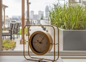 Thumbnail 6 of 60 - A clock is sitting on a table in front of a window at Current812, Clarksville, IN