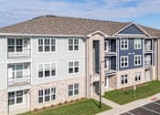 Thumbnail 29 of 29 - Apartment complex with a parking lot in front at The Warren Apartments, Jeffersonville, IN, 47130