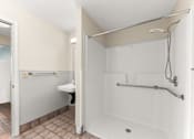 Thumbnail 7 of 68 - A white bathroom with a walk in shower at 206 Flats Apartments, Washington, 99201