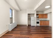 Thumbnail 40 of 68 - A kitchen with wooden floors and white appliances at 206 Flats Apartments, Washington
