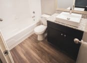 Thumbnail 17 of 24 - an empty bathroom with a sink toilet and shower