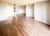 Thumbnail 21 of 24 - an empty living room with a hard wood floor