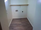 Thumbnail 19 of 24 - a room with a wood floor and white walls and a white shelf