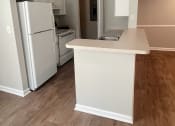 Thumbnail 6 of 6 - a kitchen with white cabinets and a white counter top