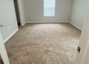 Thumbnail 5 of 6 - an empty room with a window and a door